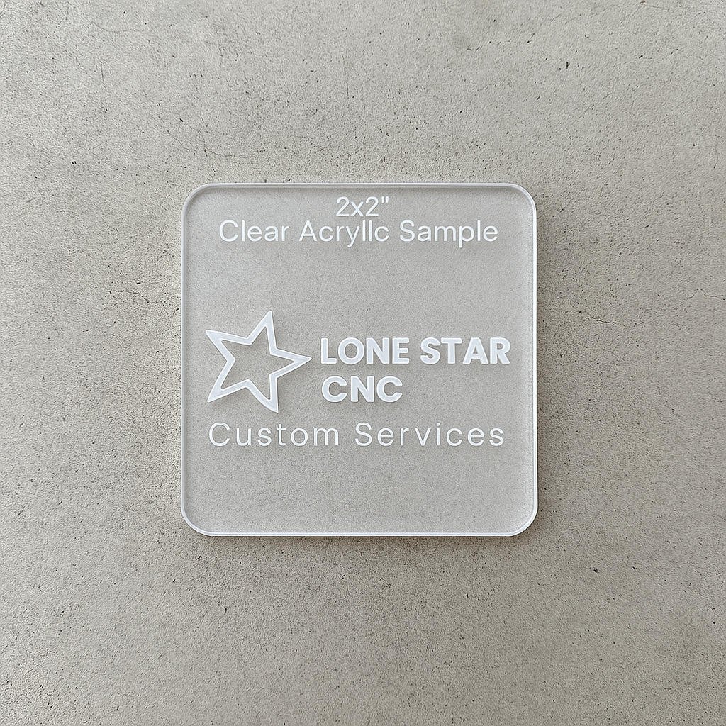 Clear acrylic sample with 'Lone Star CNC Custom Services' branding on a gray surface