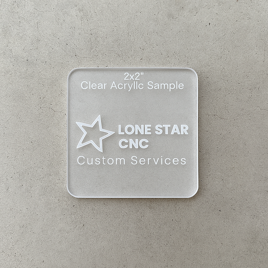 Clear acrylic sample with 'Lone Star CNC Custom Services' branding on a gray surface