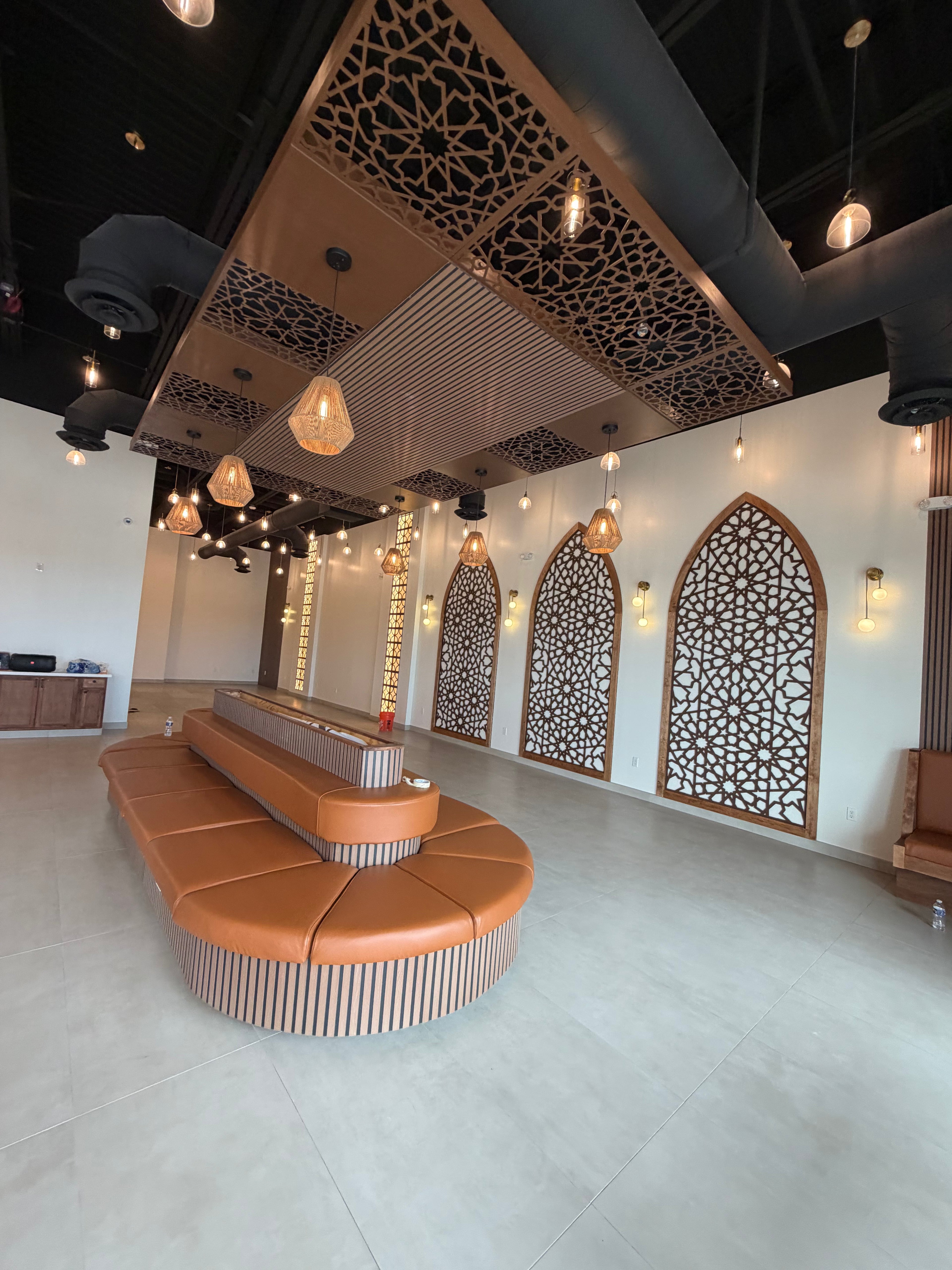 Modern interior design with decorative ceiling and wall patterns.